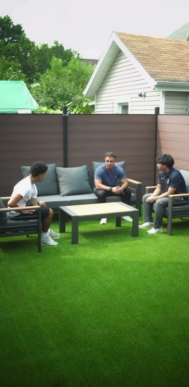 The outdoor turf terrace with lounge seating behind the North Bergen studio