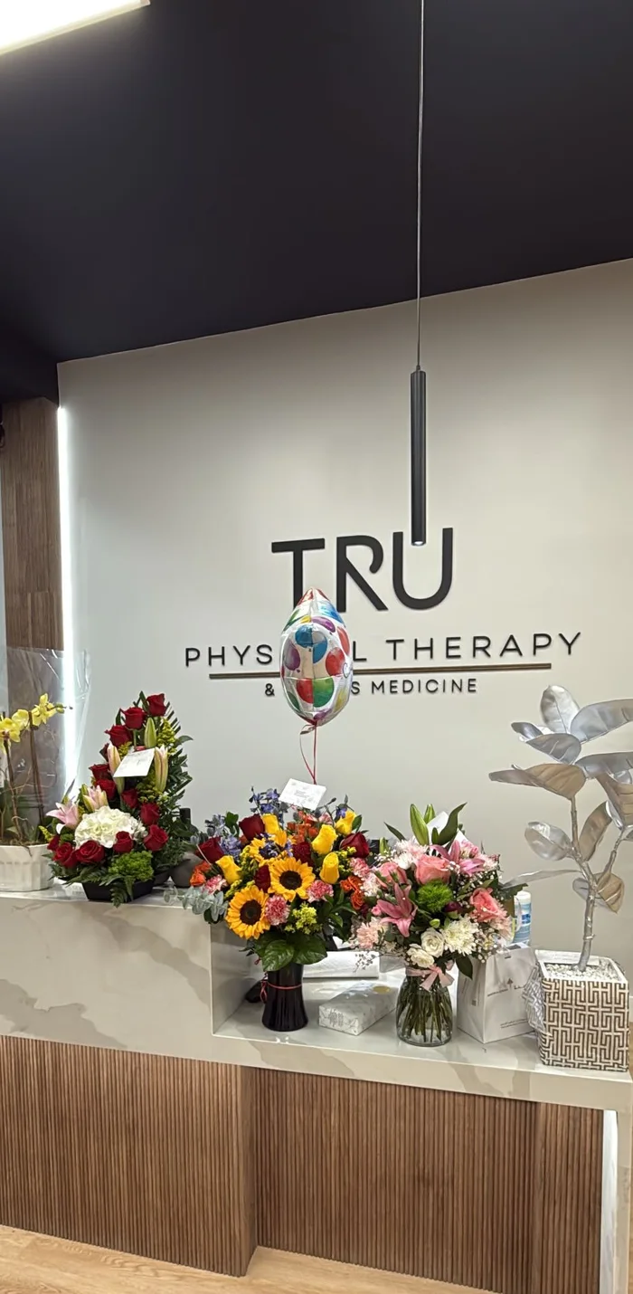 Flowers and balloons on the reception desk at the grand opening